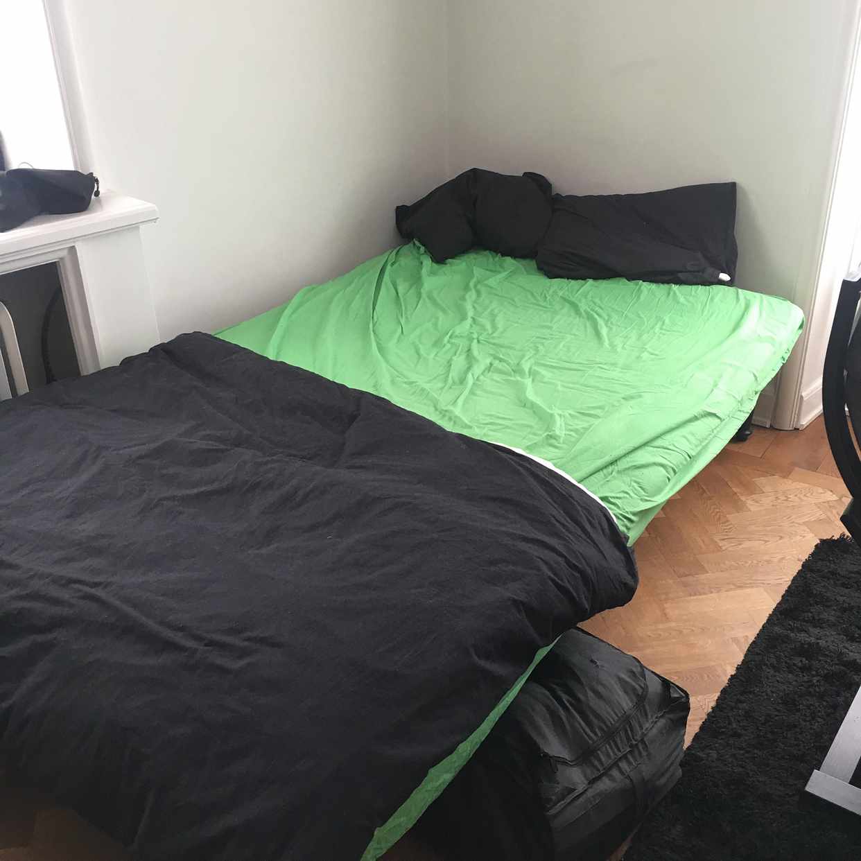 image of Old bed and small carpet - Stockholm