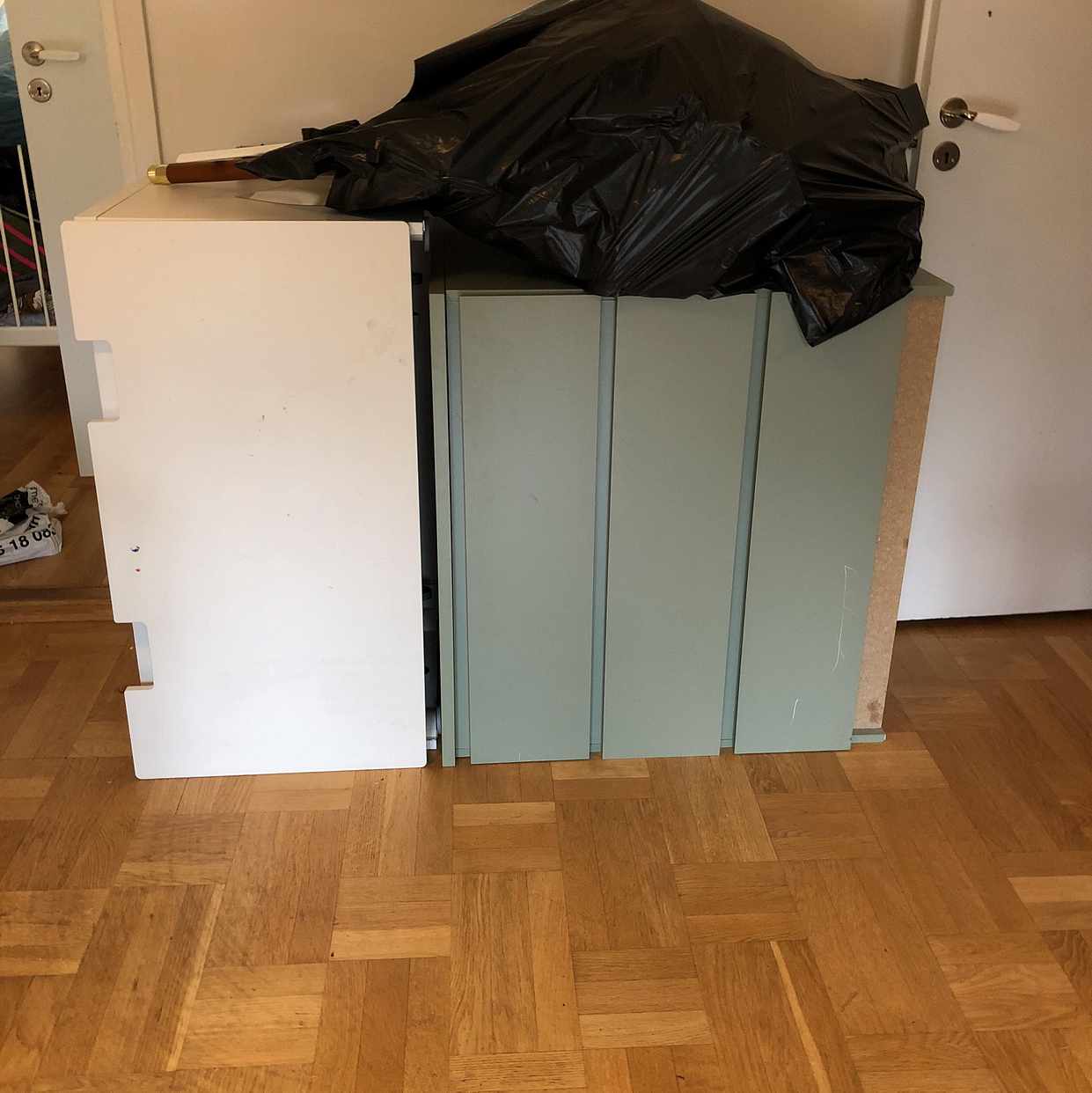 image of Två byråer och en sopsäck - Årsta