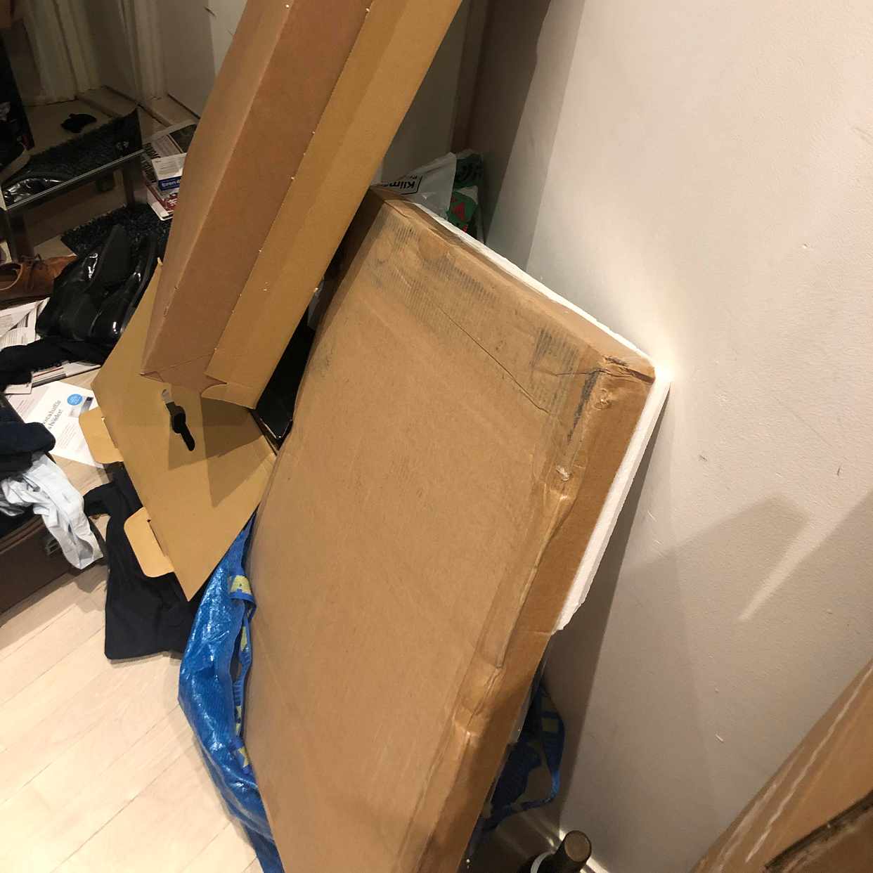 image of Cardboard boxes + closet - Stockholm