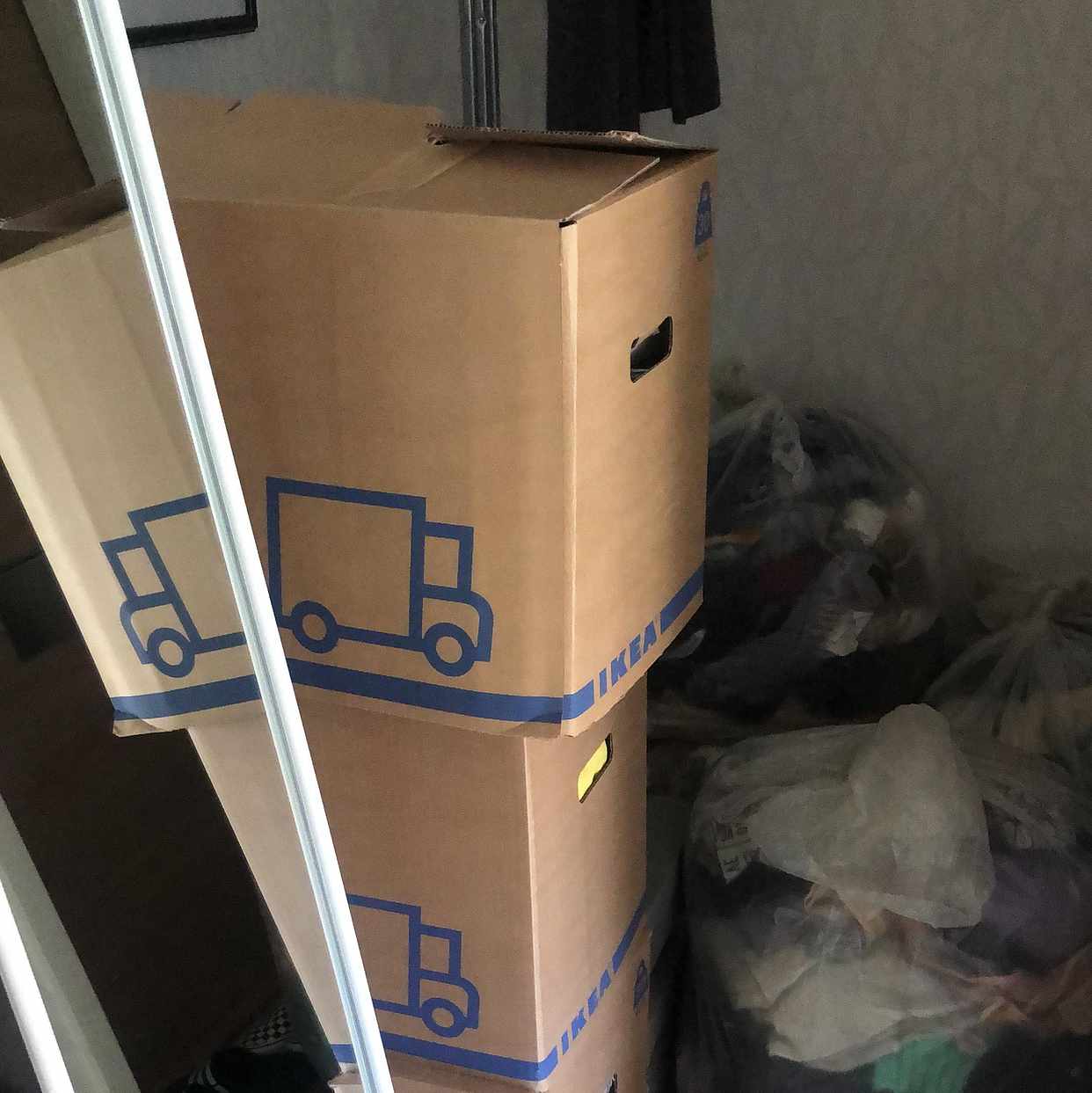 image of boxes, suitcase, clothing - 