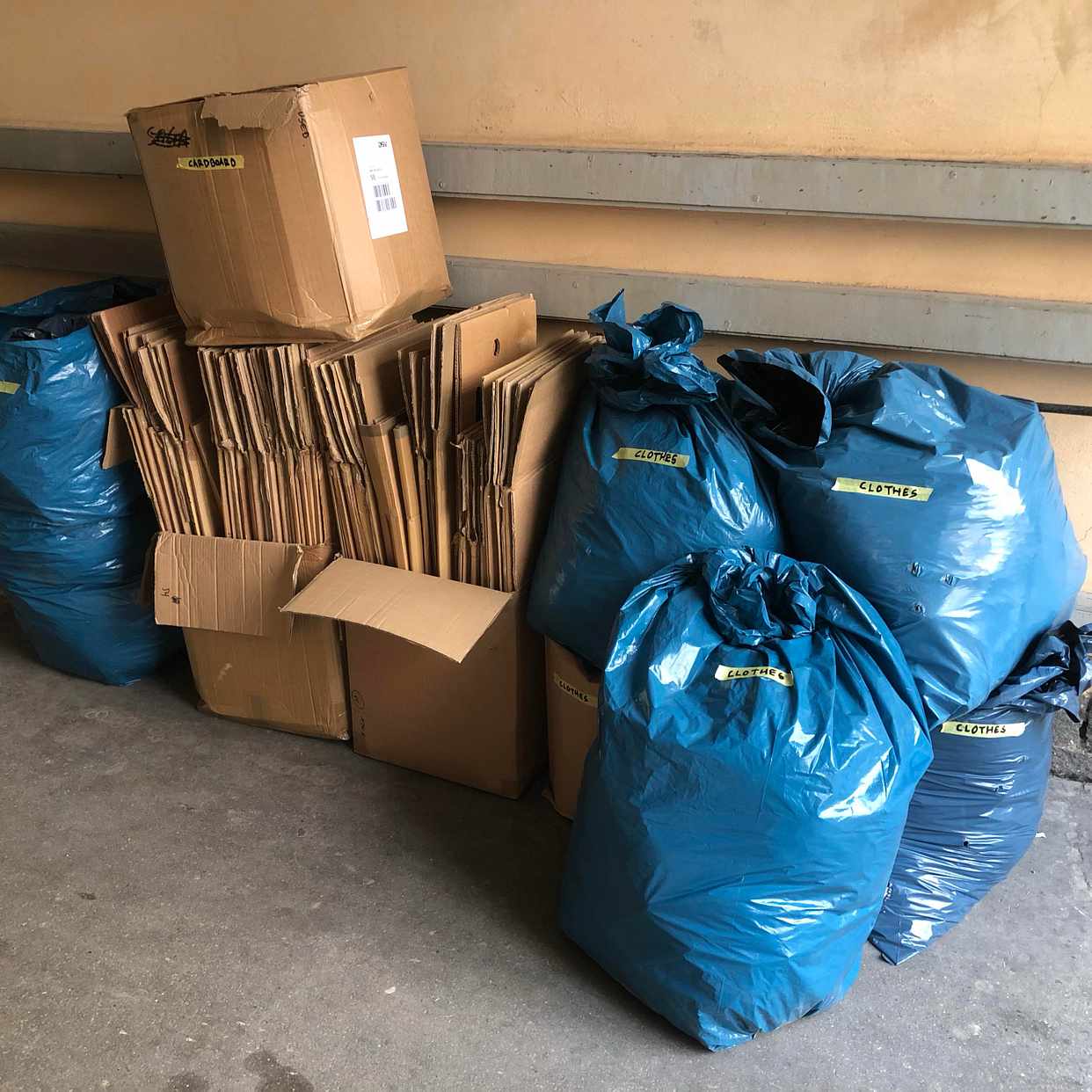 image of Cardboard, used clothes - Stockholm