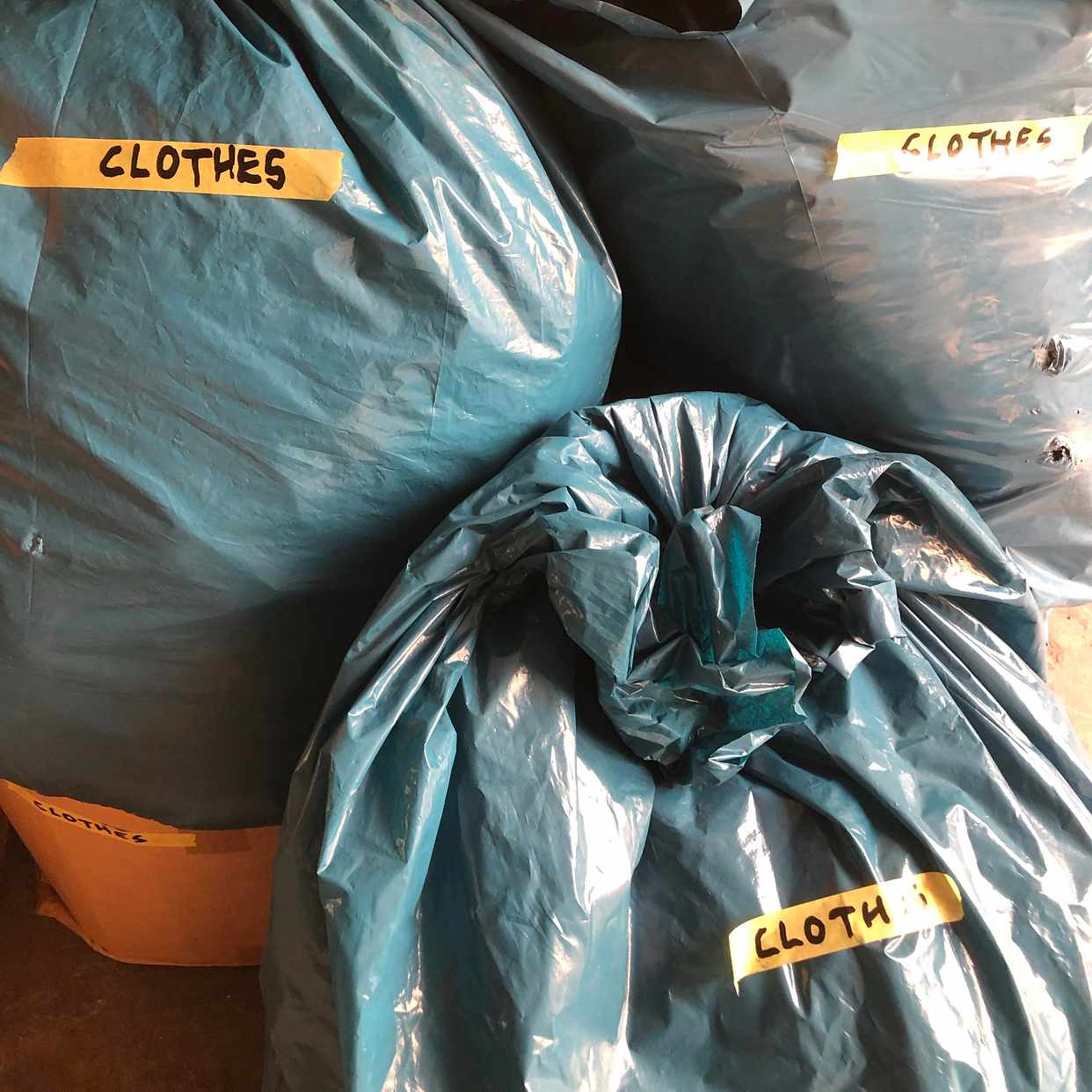 image of Cardboard, used clothes - Stockholm