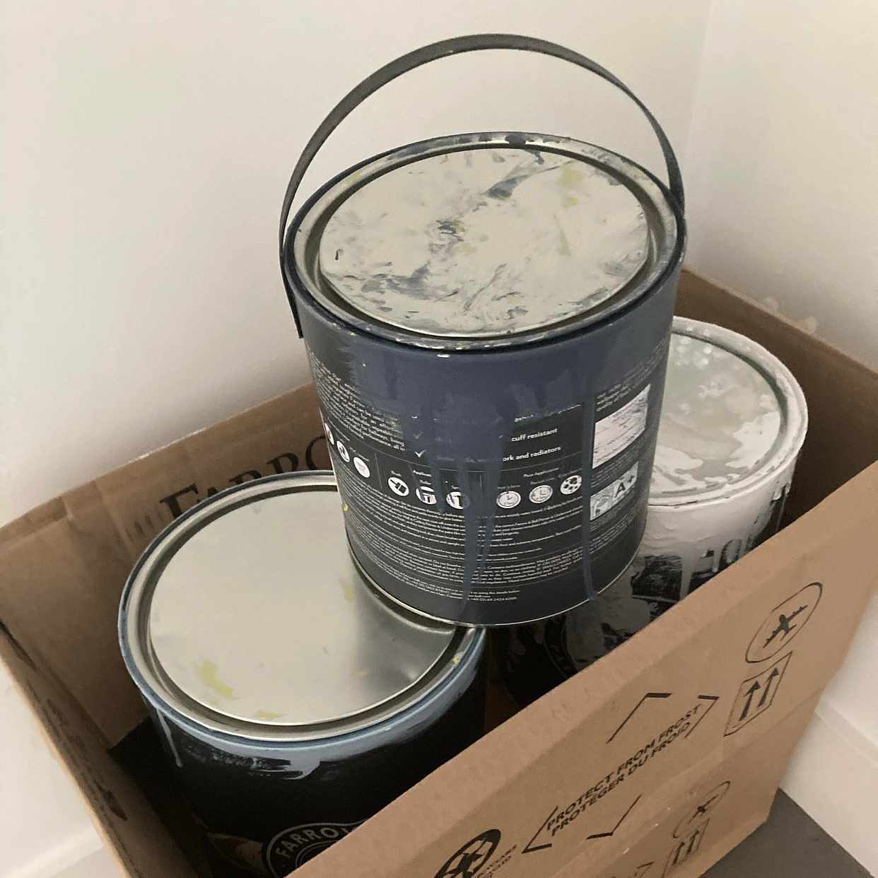 image of 5 cans of paint part used - London