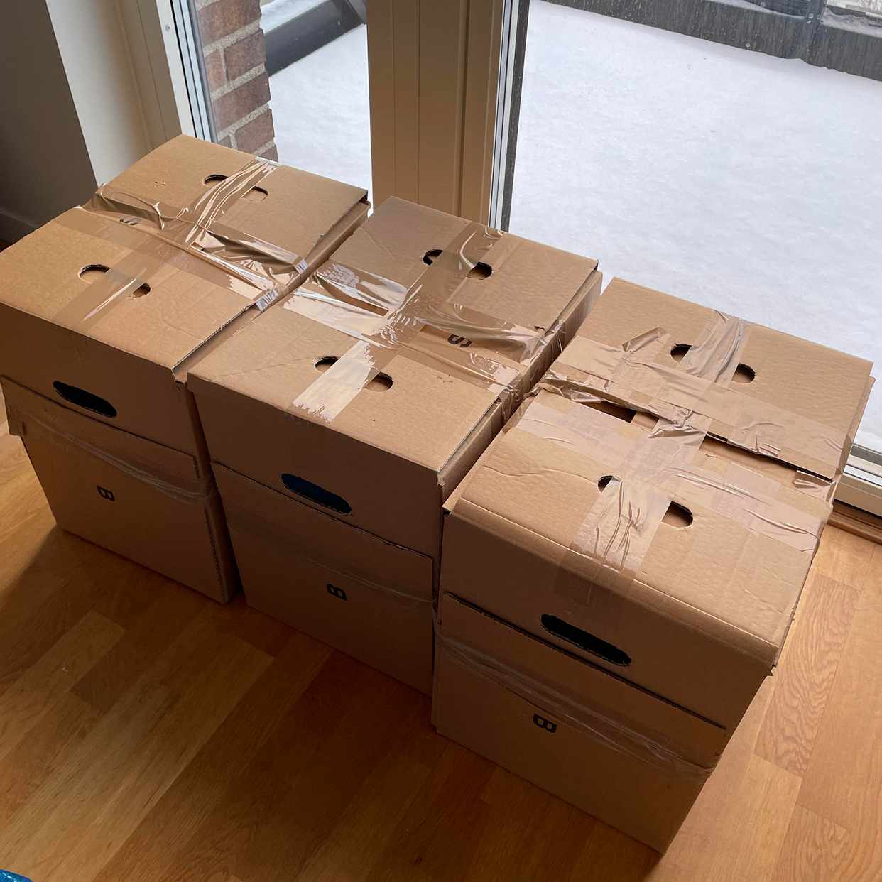 image of 3 Boxes, table, backpacks - 