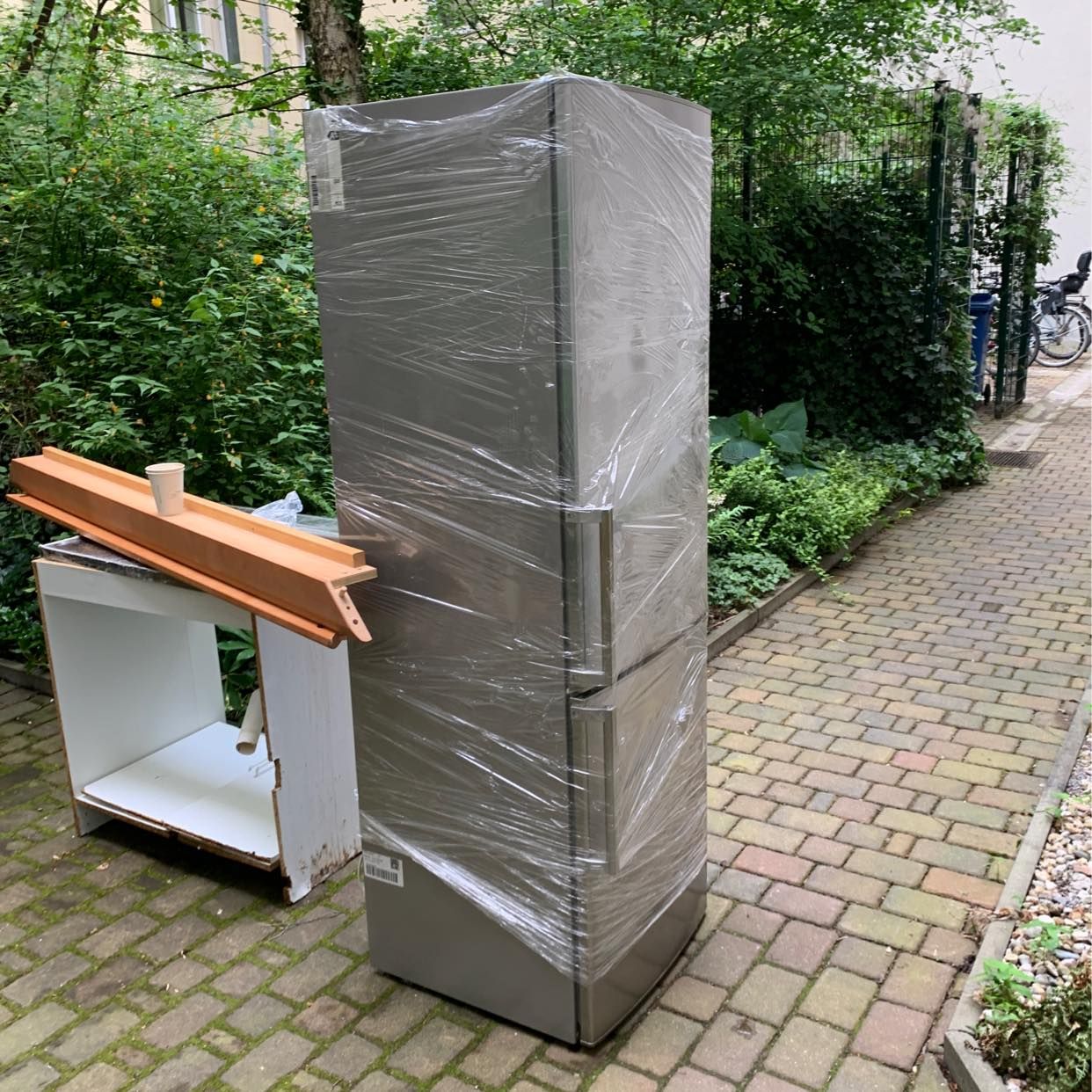image of carry a fridge 3rd floor - 