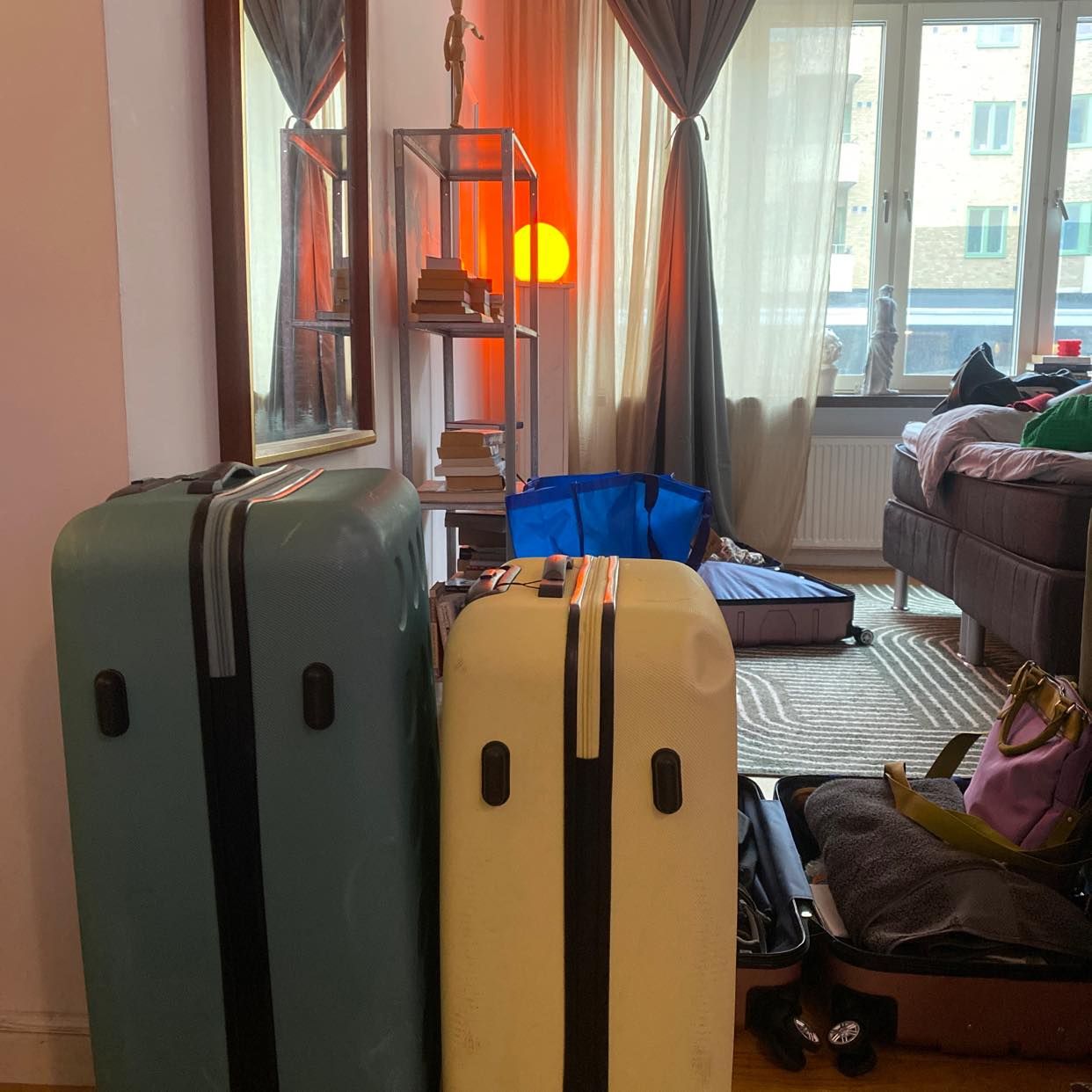 image of 4 suitcases 1 box 1 easel - 